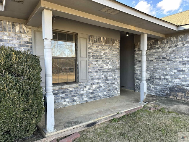 entrance to property with a porch