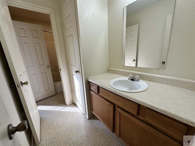 bathroom with shower / bath combination and vanity