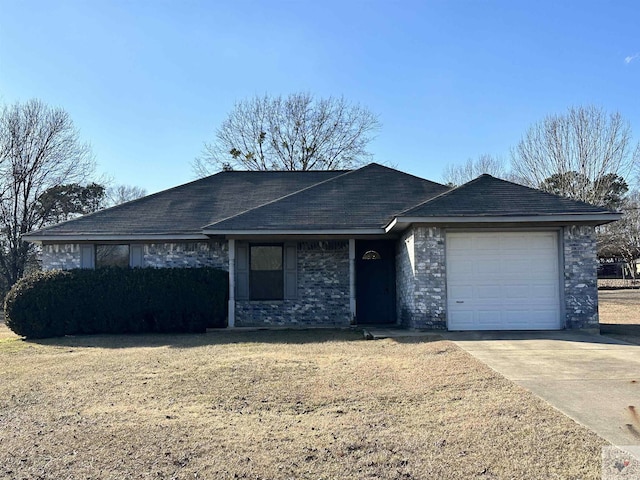 ranch-style home with a garage and a front lawn