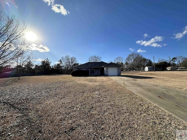 single story home featuring a garage