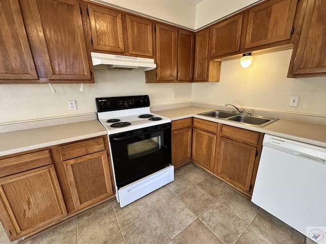 kitchen featuring dishwasher, sink, and electric range oven