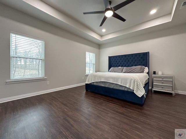 375 Fm 2149, New Boston, TX 75570 - bedroom featuring visible vents, baseboards, dark wood-style flooring, a tray ceiling, and recessed lighting