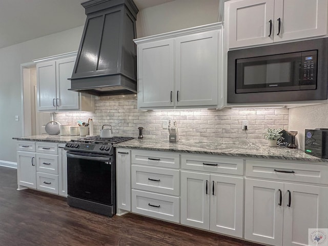 375 Fm 2149, New Boston, TX 75570 - kitchen featuring light stone counters, custom exhaust hood, built in microwave, tasteful backsplash, and gas stove