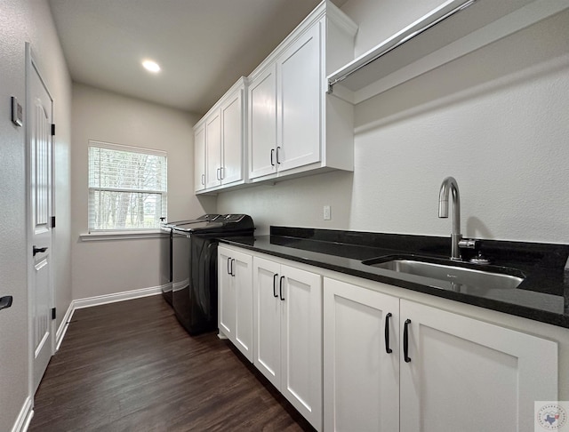375 Fm 2149, New Boston, TX 75570 - laundry room with dark wood finished floors, cabinet space, a sink, independent washer and dryer, and baseboards