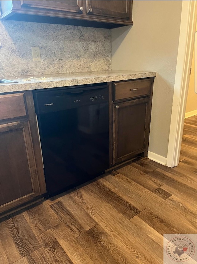 room details featuring dark brown cabinets, black dishwasher, hardwood / wood-style floors, and decorative backsplash