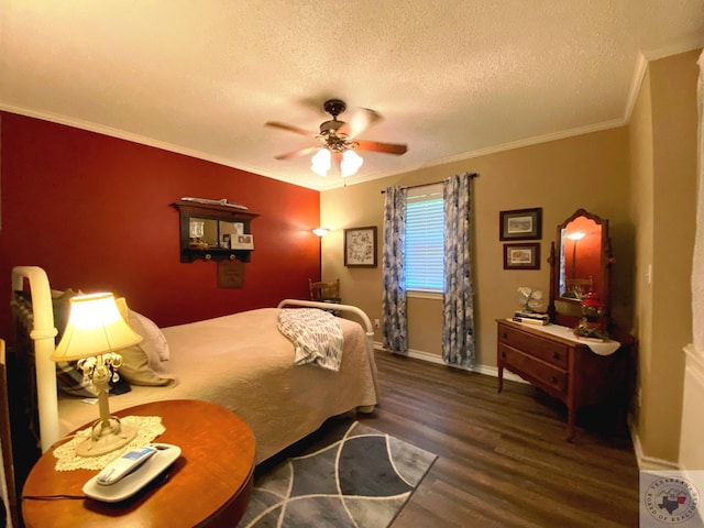 bedroom with a textured ceiling, wood finished floors, a ceiling fan, baseboards, and crown molding