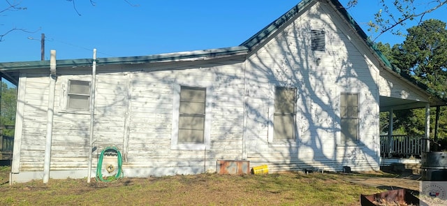 view of home's exterior with a lawn