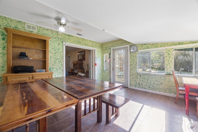 sunroom / solarium featuring ceiling fan