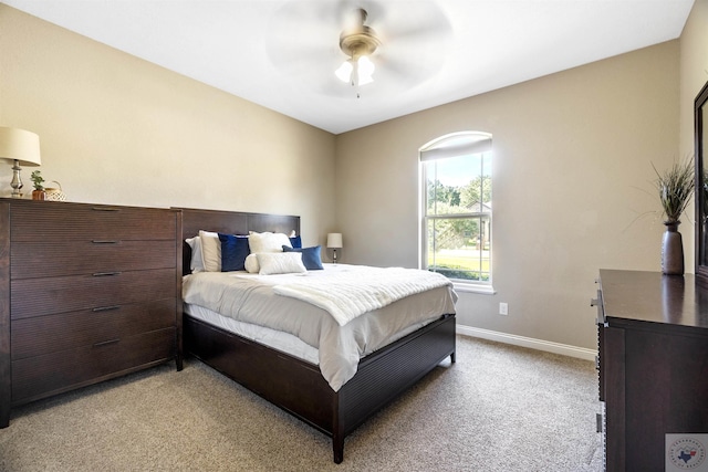 bedroom with ceiling fan and light colored carpet