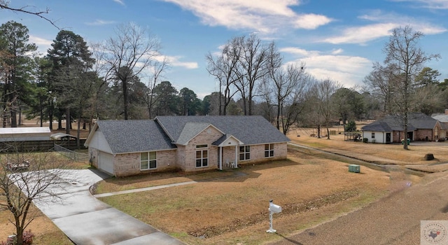 view of front of home with a garage and a front yard