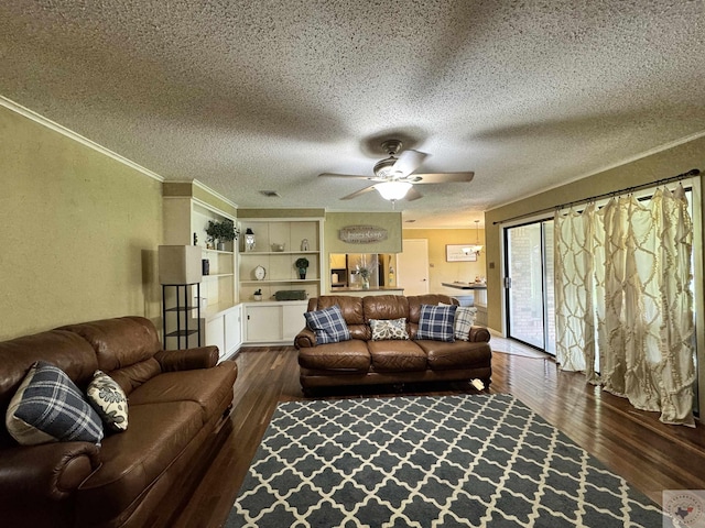 living room with ceiling fan, dark wood-type flooring, and a textured ceiling