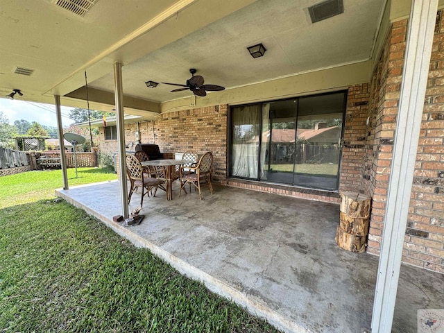 view of patio with ceiling fan and a grill