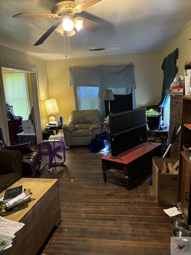 living room featuring dark wood-type flooring and ceiling fan