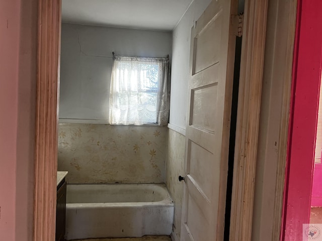 bathroom featuring vanity and a bathtub