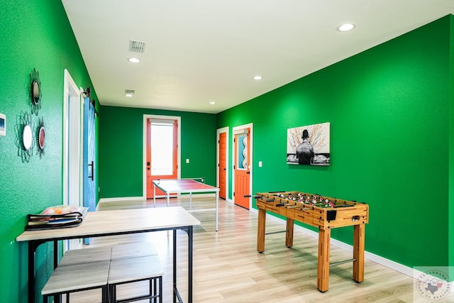 game room featuring light wood-type flooring