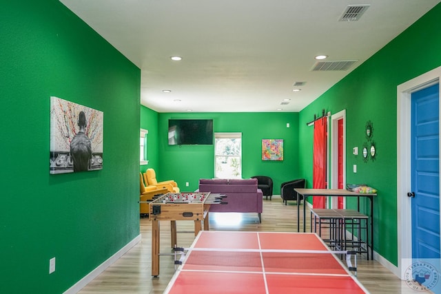 recreation room featuring wood-type flooring