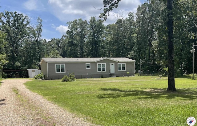 1966 George Thomas Rd, Texarkana, TX 75501 - manufactured / mobile home with dirt driveway, a carport, and a front lawn