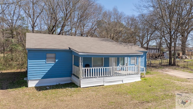 bungalow-style house with covered porch and a front yard