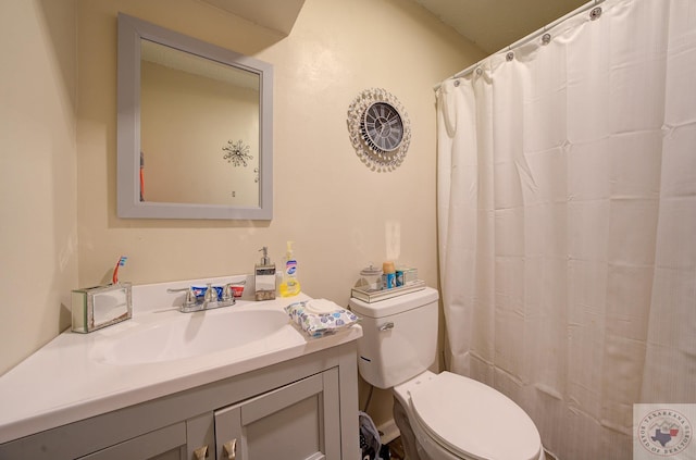 bathroom featuring toilet and vanity