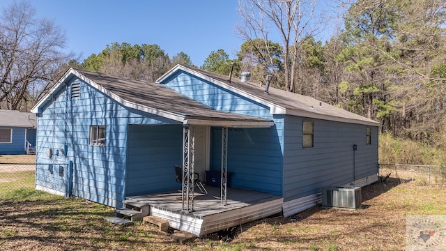 back of house featuring central AC unit