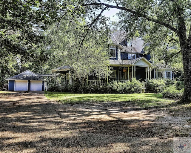 view of front of home featuring a porch and a garage