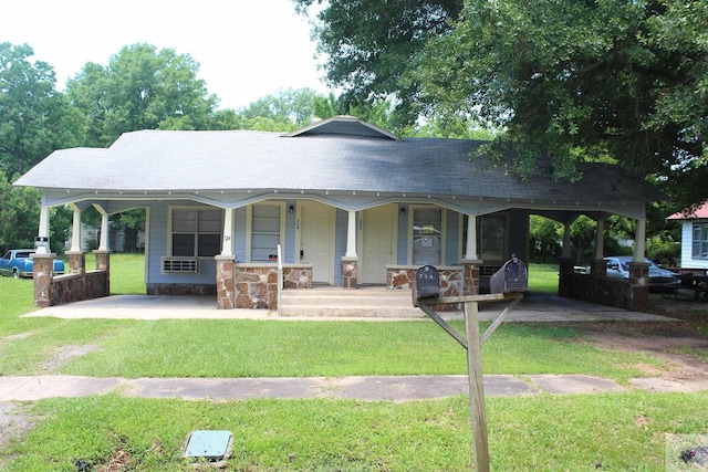 view of front of property with covered porch and a front lawn