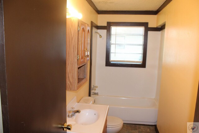 bathroom with vanity, toilet, a tub, and crown molding