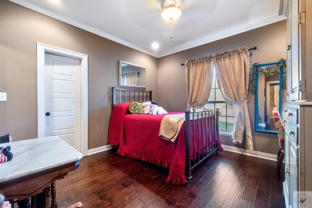 bedroom featuring crown molding, dark wood-type flooring, and ceiling fan