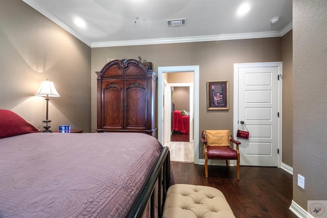 bedroom with ceiling fan, dark hardwood / wood-style flooring, and crown molding