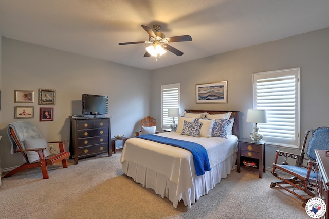 7215 N Richland Dr, Texarkana, TX 75503 - bedroom featuring light colored carpet, baseboards, and a ceiling fan