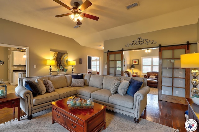 7215 N Richland Dr, Texarkana, TX 75503 - living room with vaulted ceiling, visible vents, a healthy amount of sunlight, and a barn door