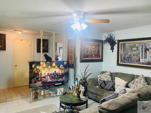 tiled living room with ceiling fan