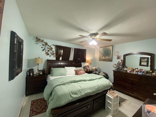 tiled bedroom with ceiling fan