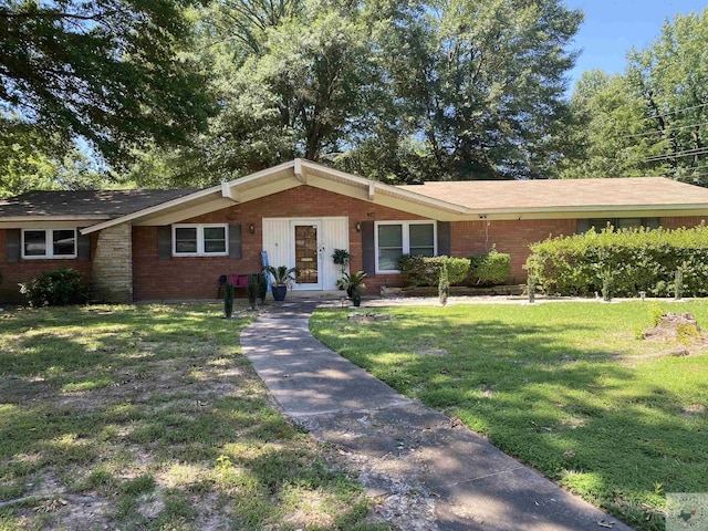 ranch-style home with a front yard