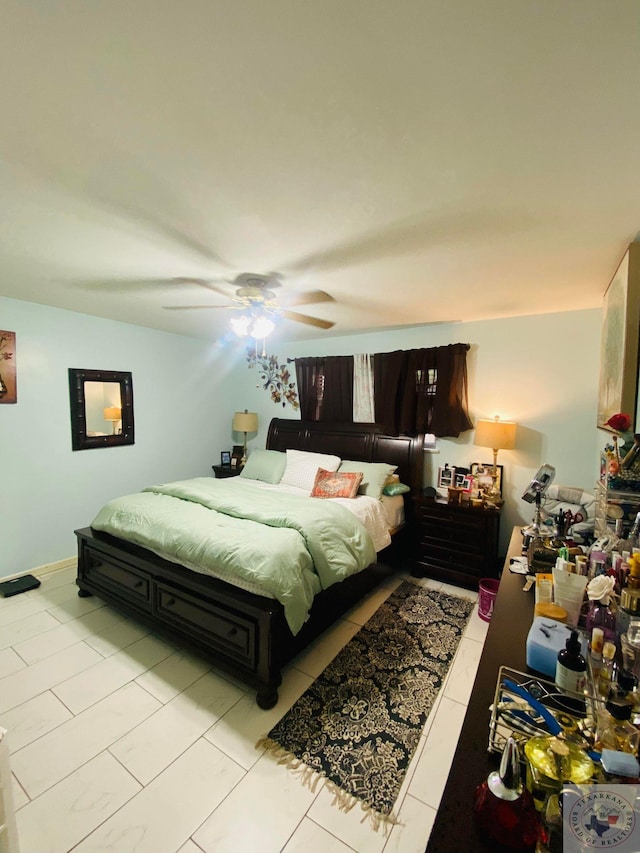 tiled bedroom with ceiling fan