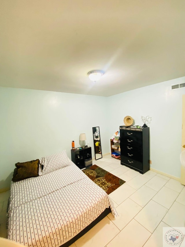 bedroom featuring light tile patterned floors