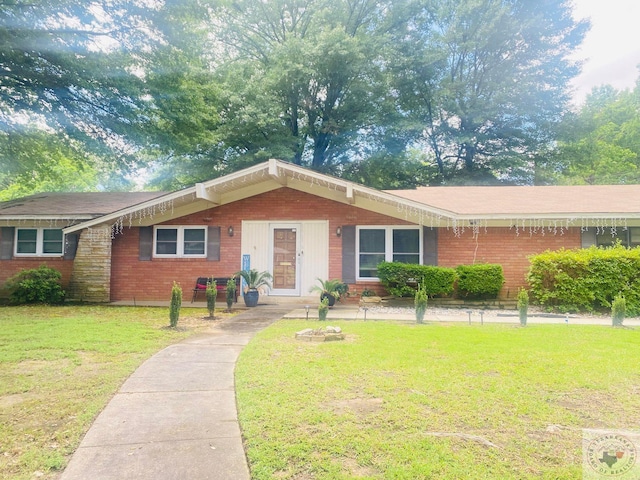 ranch-style home with a front yard