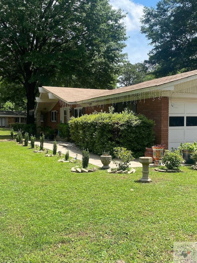 view of yard featuring a garage