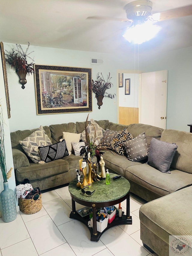 living room featuring ceiling fan and light tile patterned flooring