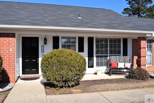 property entrance with covered porch