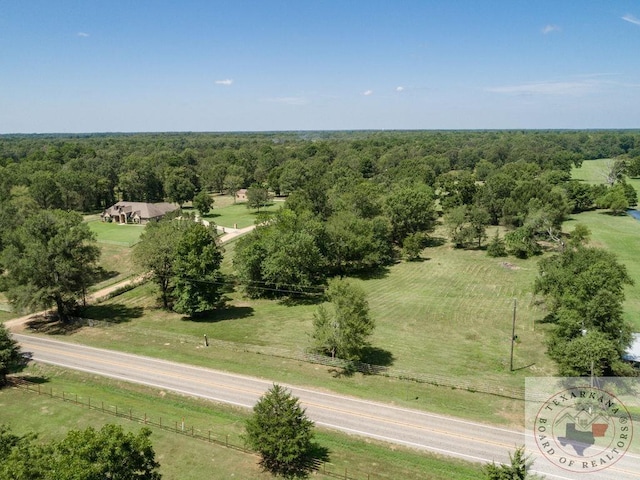 birds eye view of property with a rural view