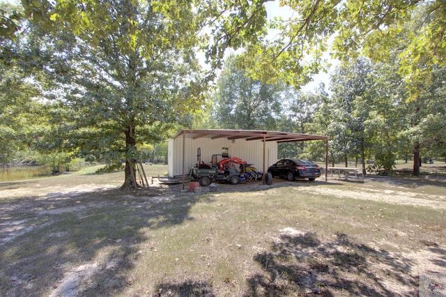 exterior space featuring a carport and a yard