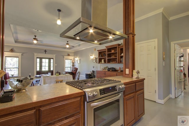 kitchen with crown molding, ceiling fan, a raised ceiling, extractor fan, and gas stove