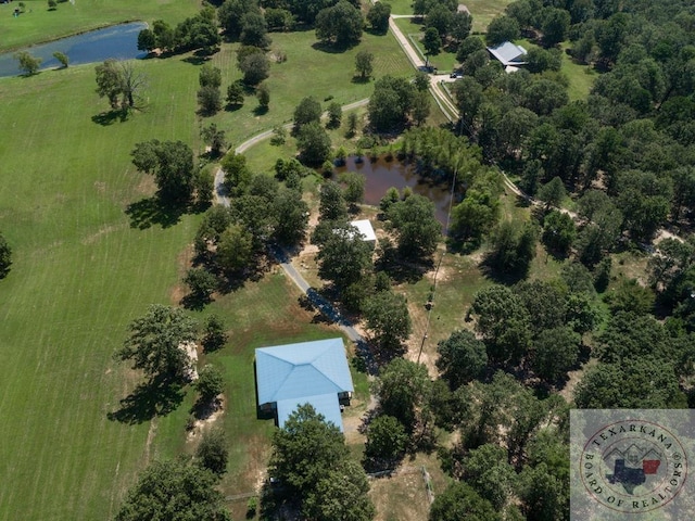 birds eye view of property featuring a rural view and a water view