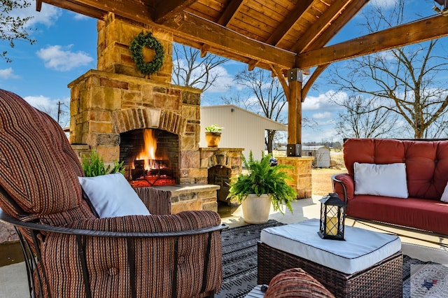 view of patio / terrace featuring an outdoor living space with a fireplace