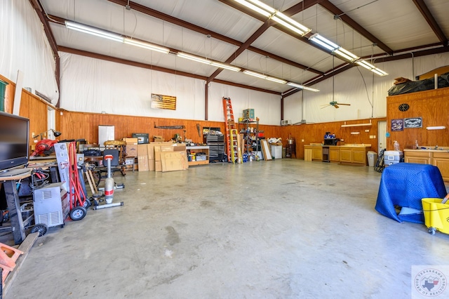 garage with a workshop area and metal wall