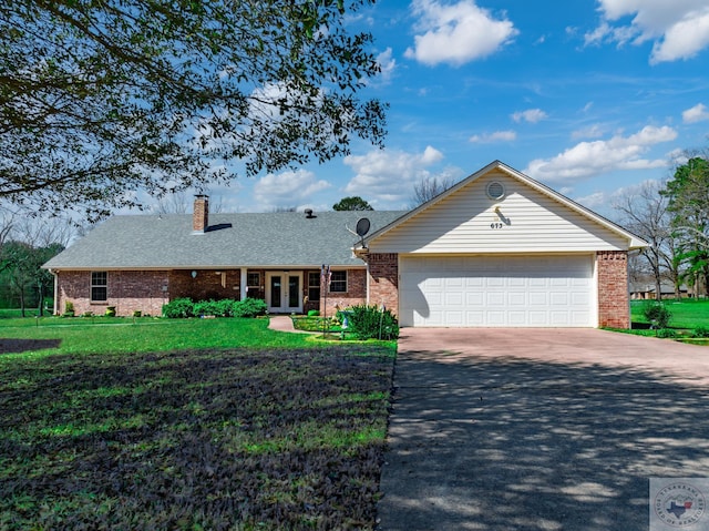 ranch-style house with concrete driveway, an attached garage, french doors, and brick siding