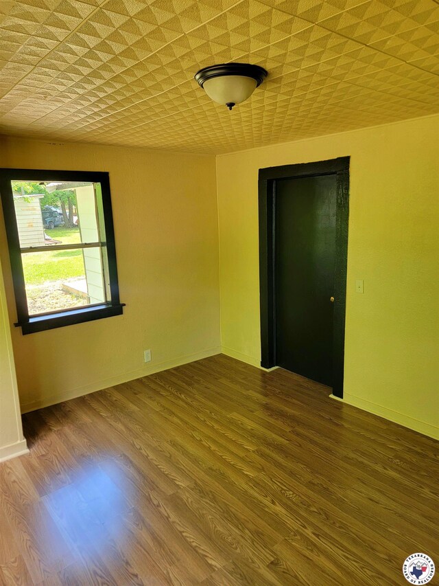 501 S Columbia St, Clarksville, TX 75426 - spare room with wood finished floors and baseboards