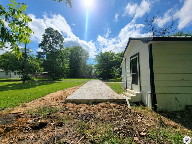 501 S Columbia St, Clarksville, TX 75426 - view of grassy yard featuring entry steps