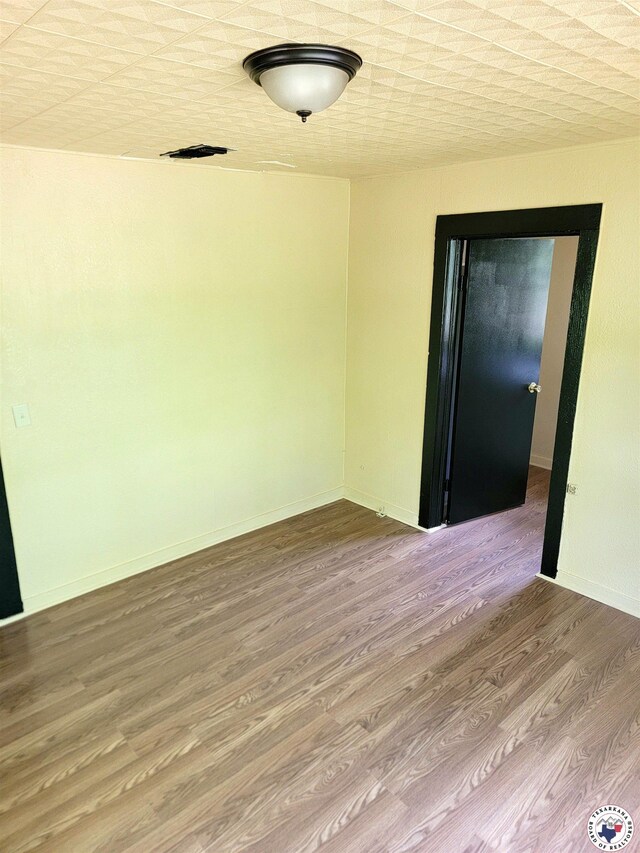 501 S Columbia St, Clarksville, TX 75426 - empty room featuring wood finished floors and baseboards